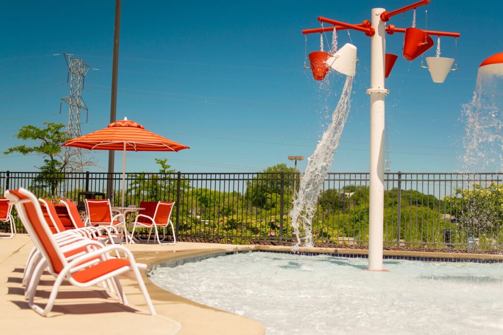 Outdoor splash pad with water features