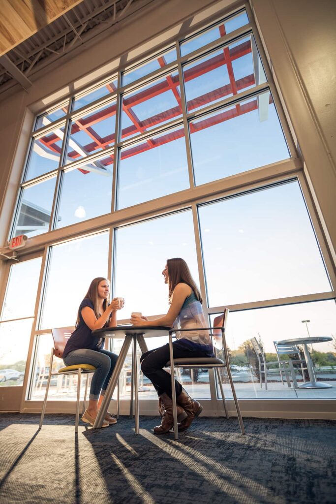 Women gather for a cup of coffee in the lobby