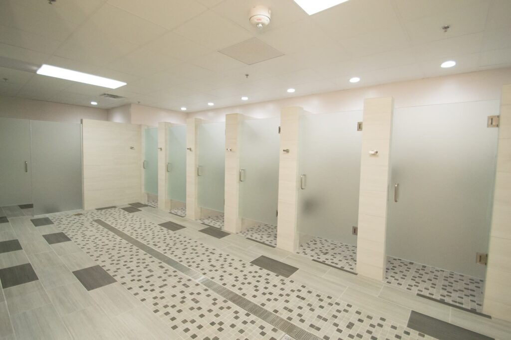 Bright and clean shower area in the women's locker room