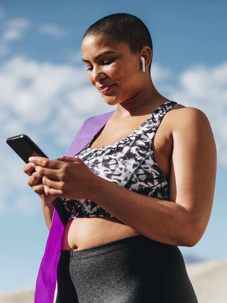 Woman uses a workout plan on her phone