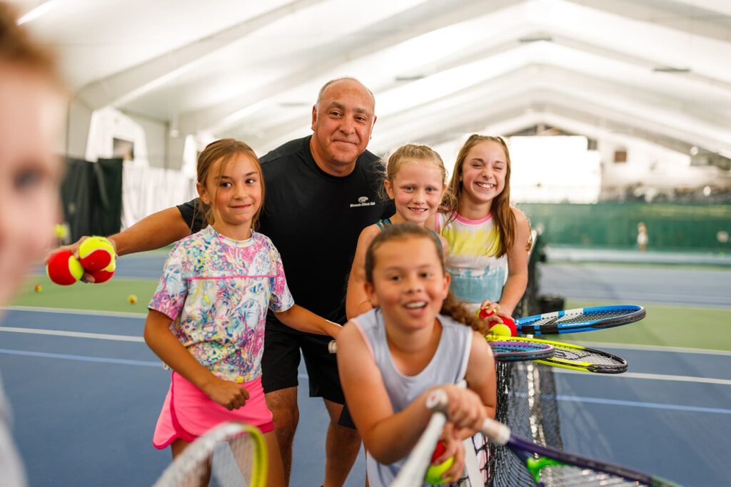 Kids learn to play tennis