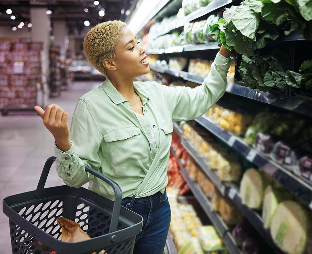 Woman goes shopping for fresh vegetables