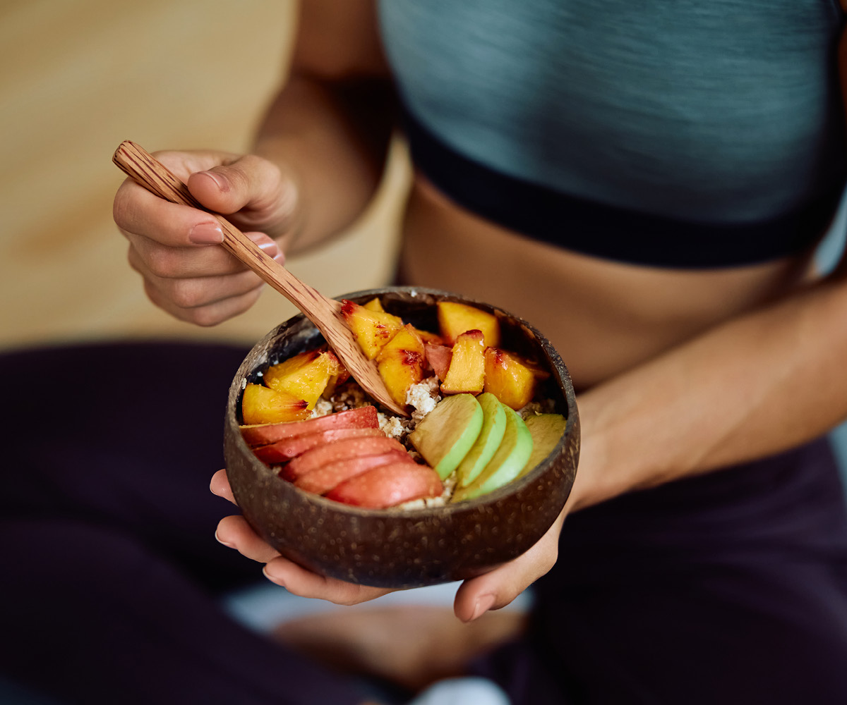 woman eats healthy meal before working out