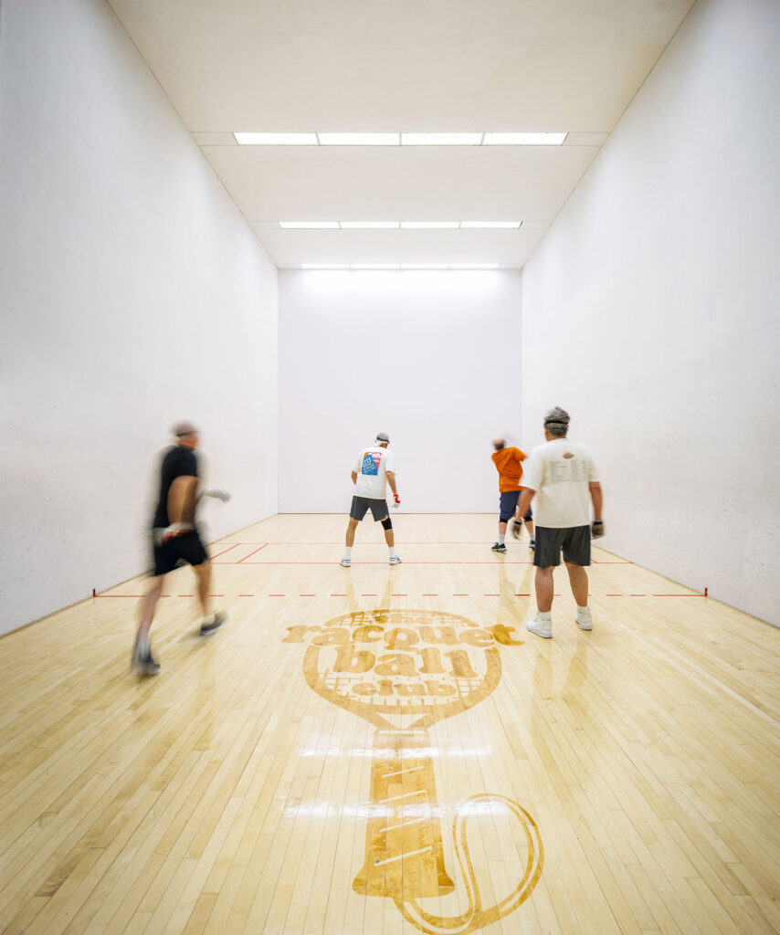 Four men play handball on the racquetball courts at WAC West Allis