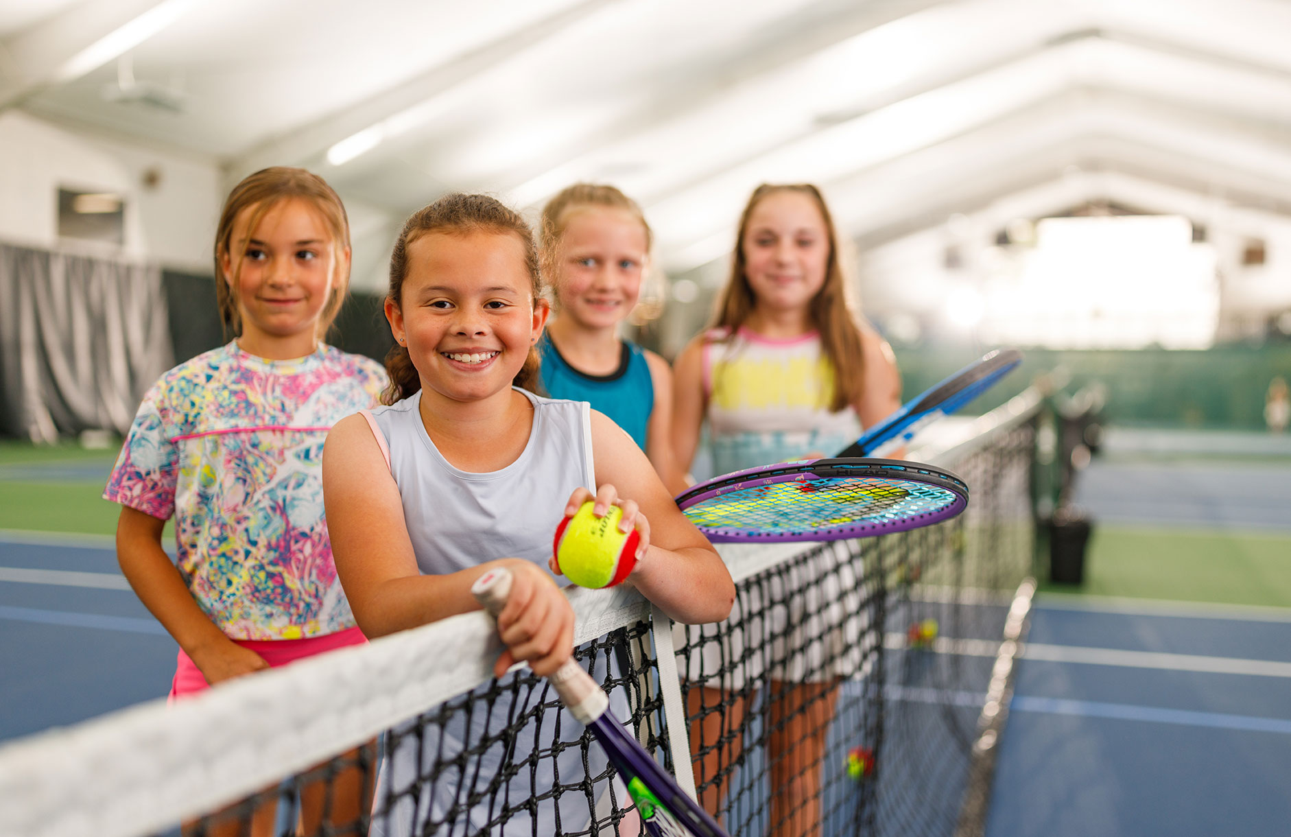 Kids learn to play tennis in Junior Tennis Classes at the WAC