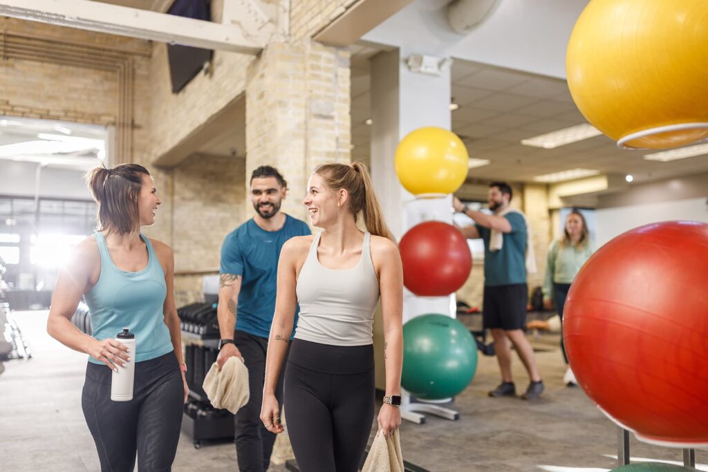 Group of friends work out together at a fitness center